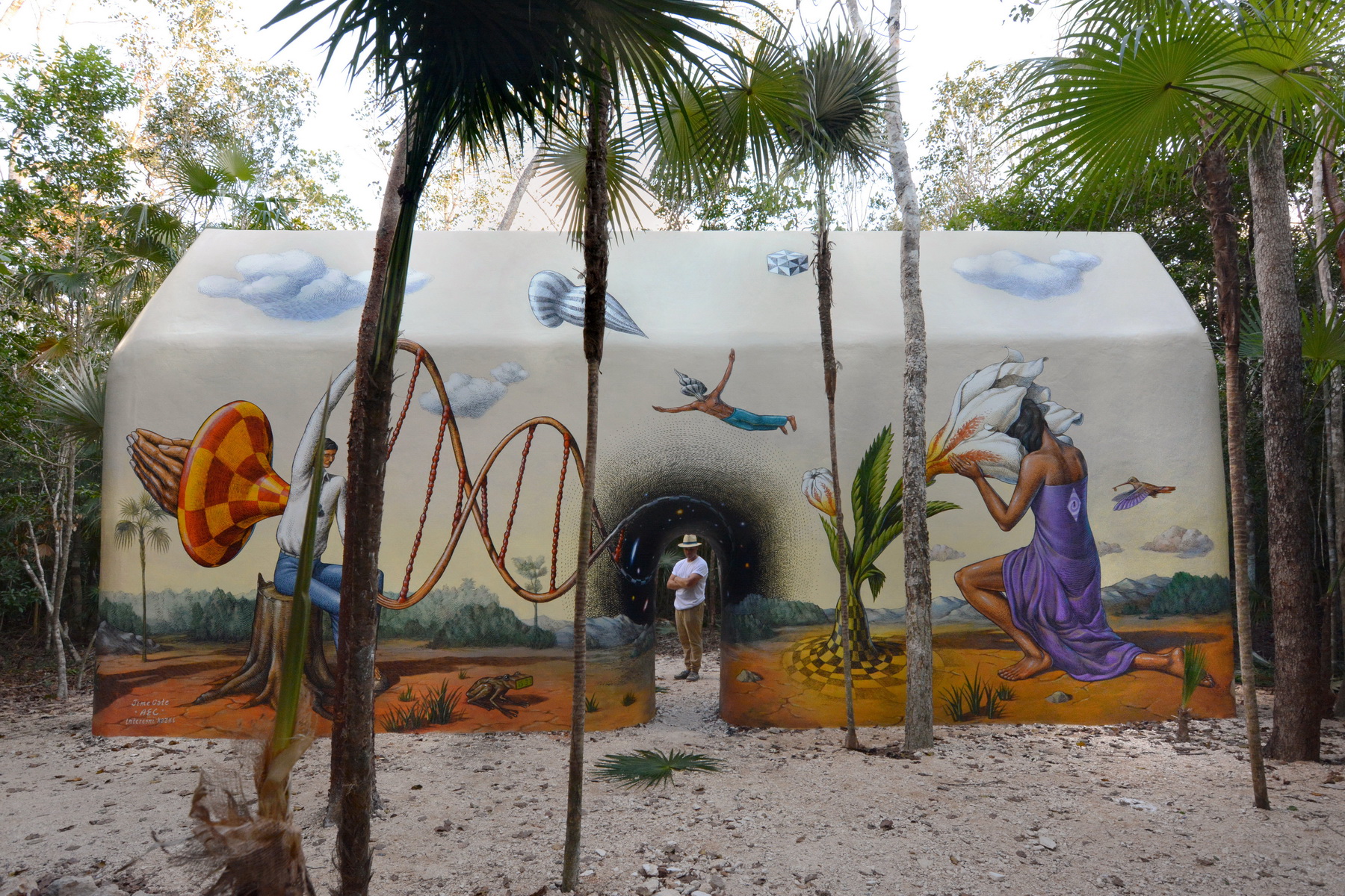 Original Time Gate mural panels in the Holistika jungle, with a portal, frog and flower-bearing figure
