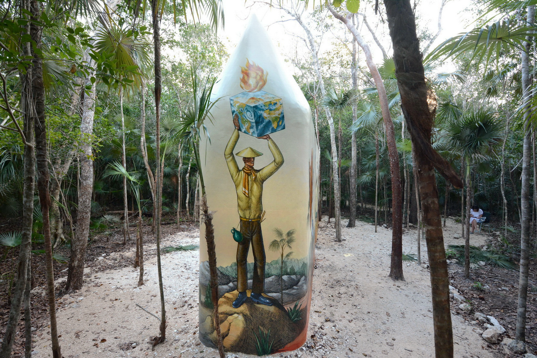 Original cube-bearing figure from Time Gate surrounded by tropical forest